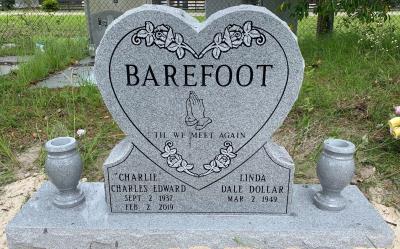 gray granite heart shaped companion headstone with flower vases